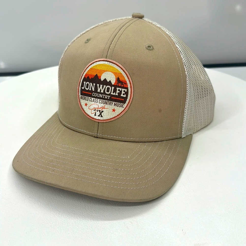 Jon Wolfe Country, Trucker Hat. Cleaned sanitized pre-Owned condition. SnapBack